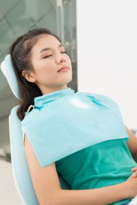 Photo of woman under sedation at the dentist - Sedation options